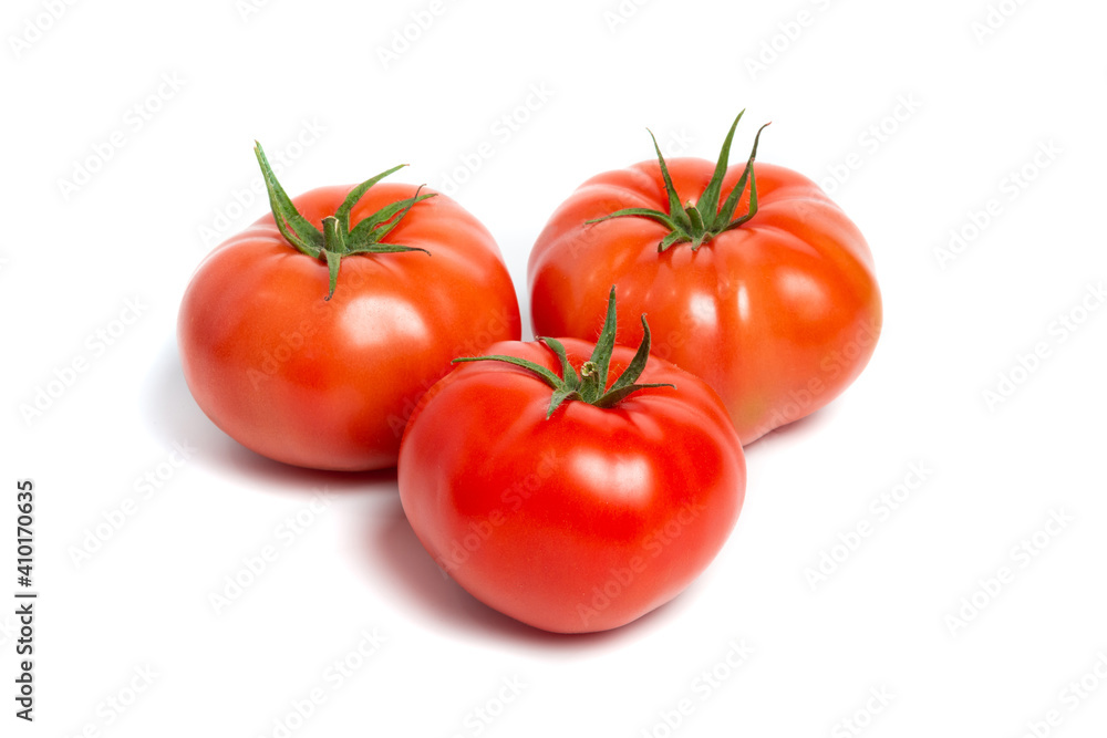 a few tomatoes on a white background with a shadow.