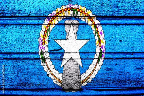 National flag of Northern Mariana Islands, abbreviated with mp; a realistic 3d image of the national symbol from an independent country painted on a wooden wall photo