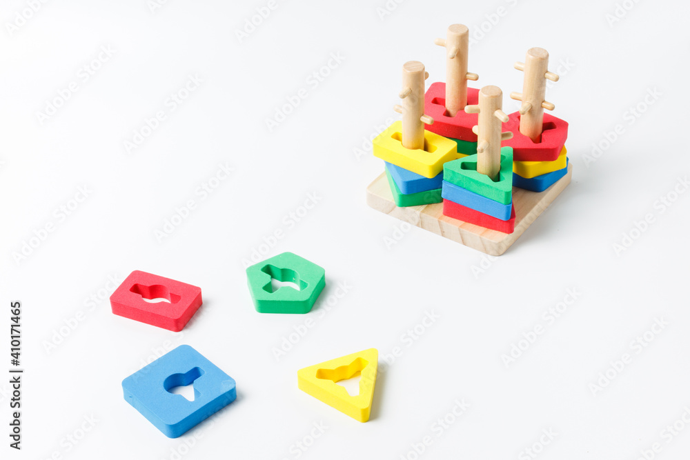 Children's logic game, puzzle. Colorful bright details, sorter. On a white background with space Children's logic game, puzzle. Colorful bright details, sorter. On a white background with space
