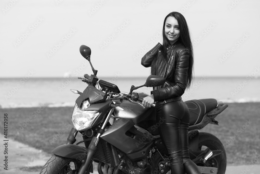 Naklejka premium young woman on a motorcycle