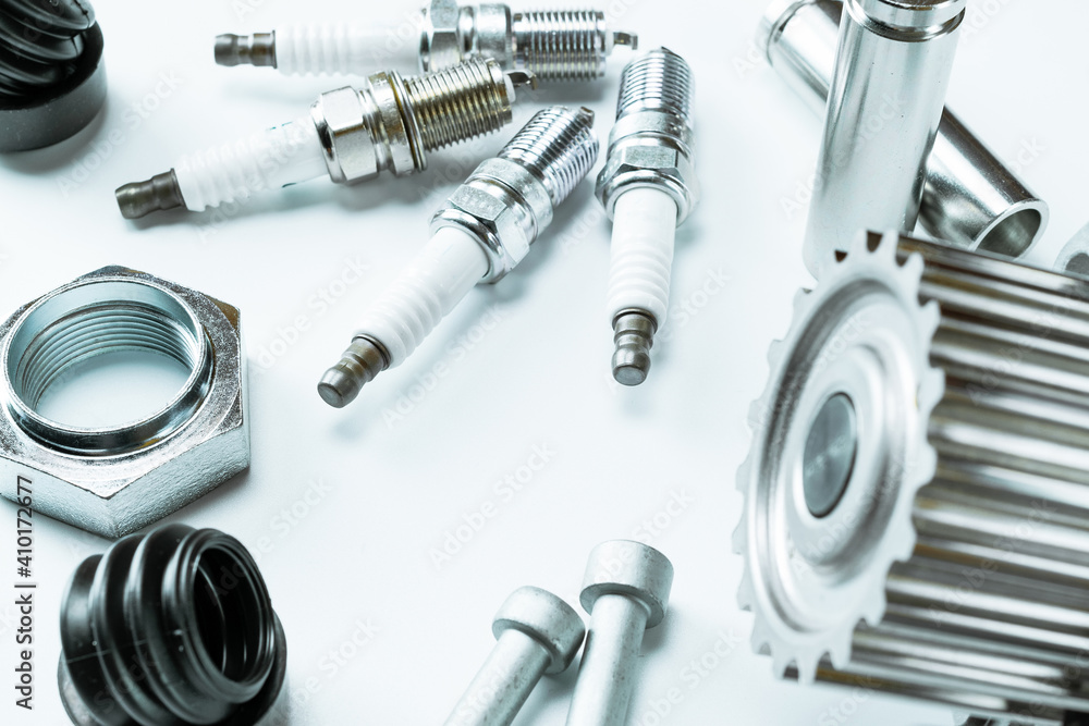 Spark plugs. Auto motor mechanic spare or automotive piece on white background. Set of new metal car part. Repair and vehicle service. Spark plugs. Auto motor mechanic spare or automotive piece on white background. Set of new metal car part. Repair and vehicle service.