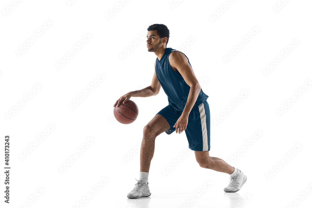 Strategy. Young arabian muscular basketball player in action, motion isolated on white background. Concept of sport, movement, energy and dynamic, healthy lifestyle. Training, practicing.