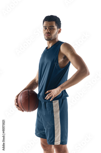 Unstoppable. Young arabian muscular basketball player posing confident isolated on white background. Concept of sport, movement, energy and dynamic, healthy lifestyle. Training, practicing. © master1305