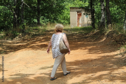 person walking in the woods