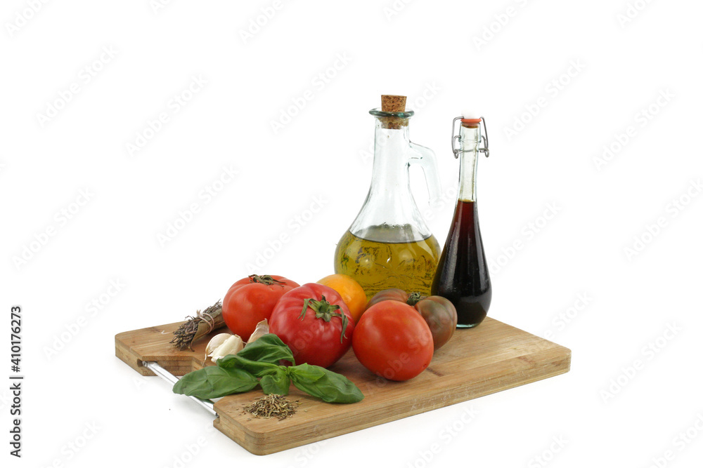 oil and tomatoes isolated on white background oil and tomatoes isolated on white background