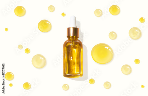 Oil serum glass bottle and collagen drops realistic vector illustration, top view. Aromatherapy oil. Cosmetic skincare anti-age fluid