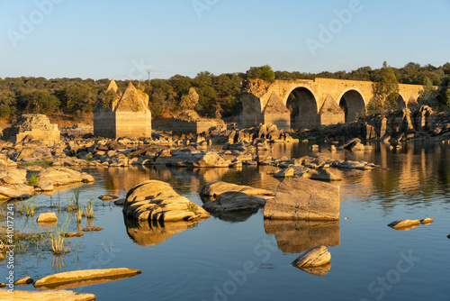 Destroyed abandoned Ajuda bridge crossing the Guadiana river between Spain and Portugal photo