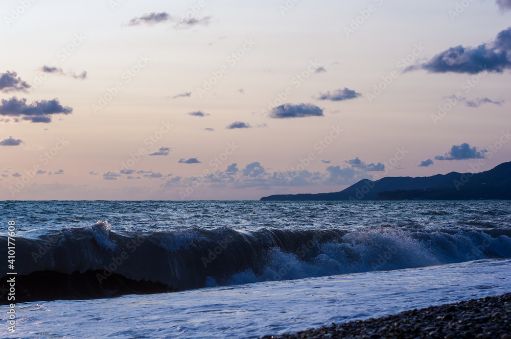 Fototapeta premium Amazing sea sunset, the sun, waves, clouds