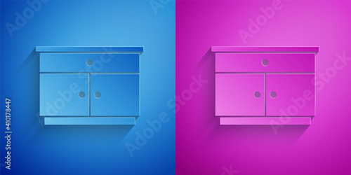 Paper cut Furniture nightstand icon isolated on blue and purple background. Paper art style. Vector.