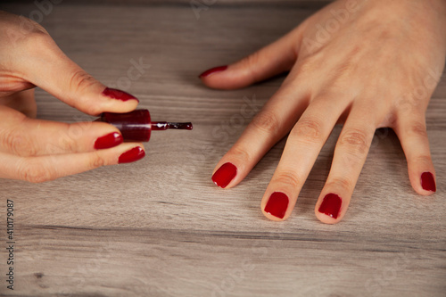 woman hand nail varnish