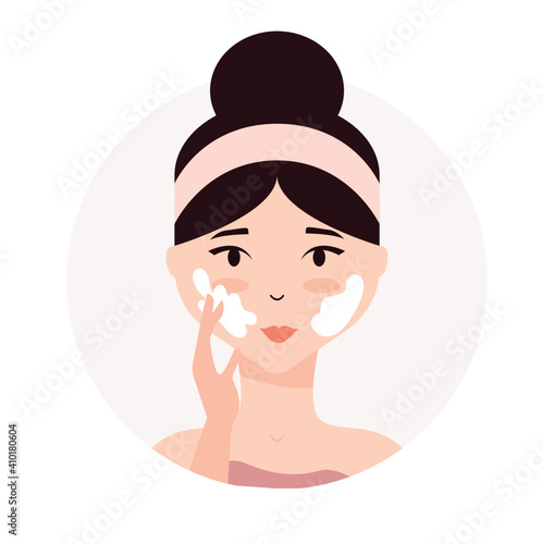 Woman taking care of her face. Daily skincare routine. Young woman applying facial cream to her face . Skin hydration, moisturizing