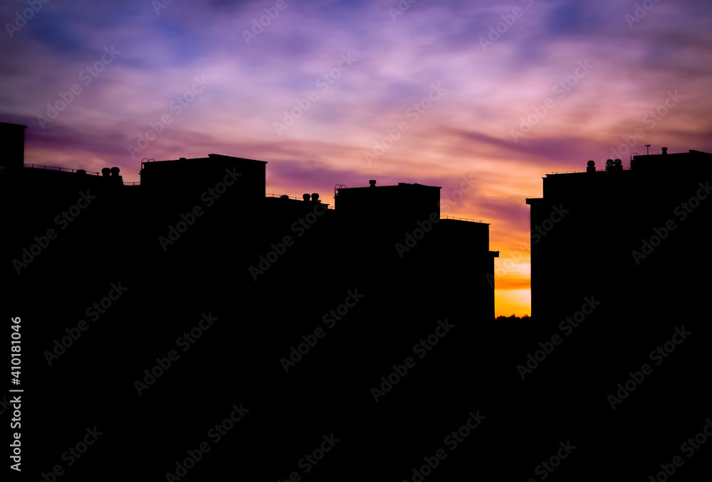 The silhouette of the cityscape at sunset