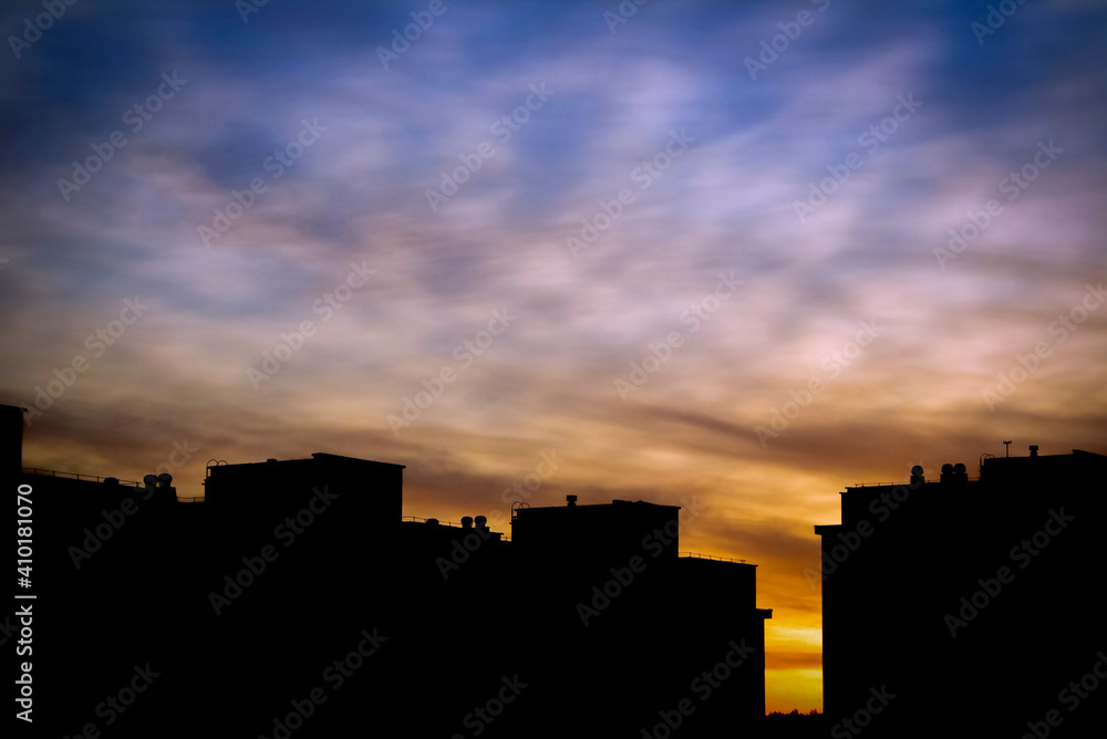 The silhouette of the cityscape at sunset