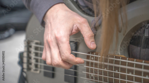 musician playing guitar, close up
