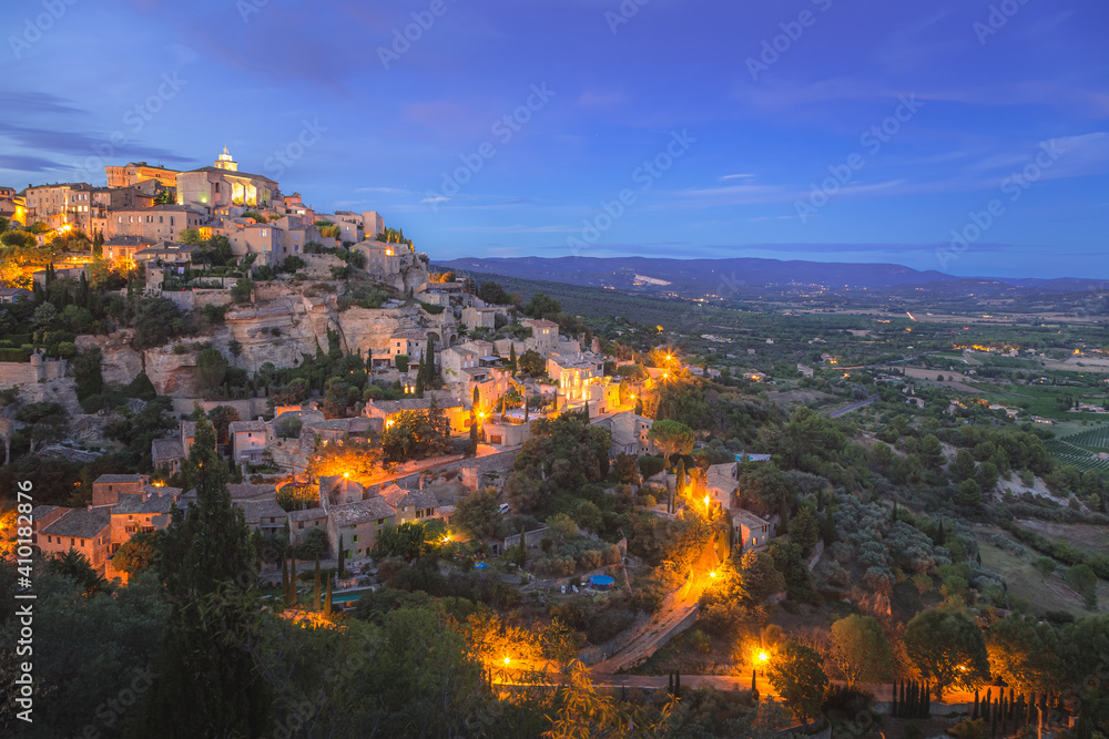 A stunning summer's evening view of the beautiful and historic hilltop village of Gordes, in Provence France