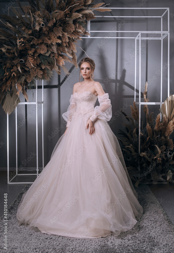 Fototapeta premium young girl in a luxurious wedding dress