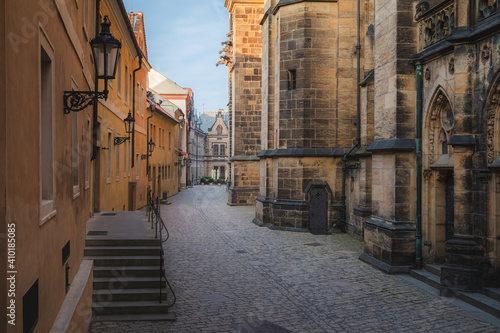 Evening golden light along the ancient pathway beside St. Vitus Cathedral on the grounds of Prague Castle. © Stephen