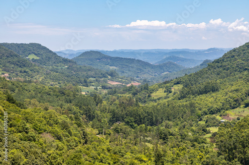 Forest over mountain, valley and farm plantation © lisandrotrarbach