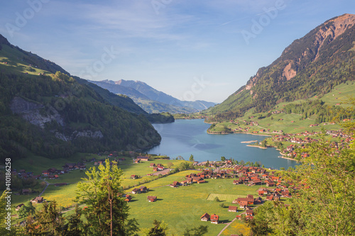 A view over the beautiful Lake Lungern (Lungerersee) on a clear sunny day taken from Schoenbuehel viewing point. photo