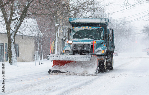Snowplow clearing a strreet during a snow storm