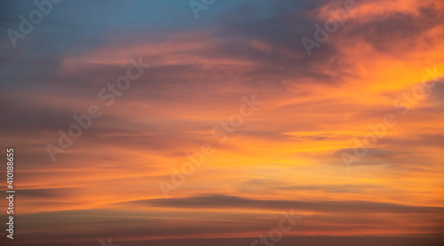 Beautiful colorful bright sunset sky with orange clouds. Nature sky background. Dramatic sunset.