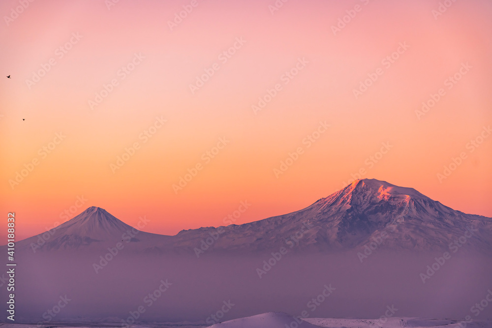 Beautiful winter landscape on the sunrise . The mountain peak snow-covered on the sunset.  Ararat mountain.