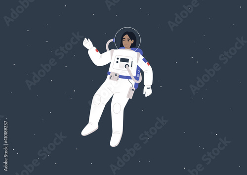 Young female astronaut wearing a spacesuit floating between the stars