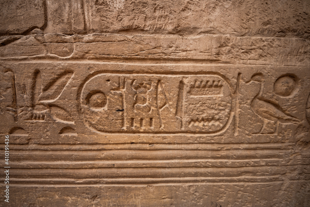 ancient Egyptian hieroglyphs on a wall in the Karnak Temple of Luxor
