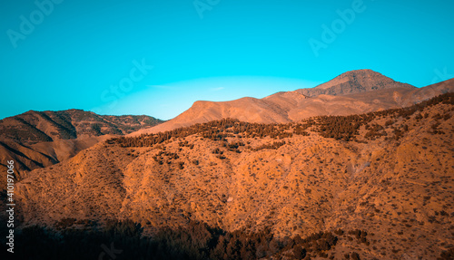 Dry mountainous landscapes in the High Atlas mountain range in Morocco at sunrise © Jack Krier