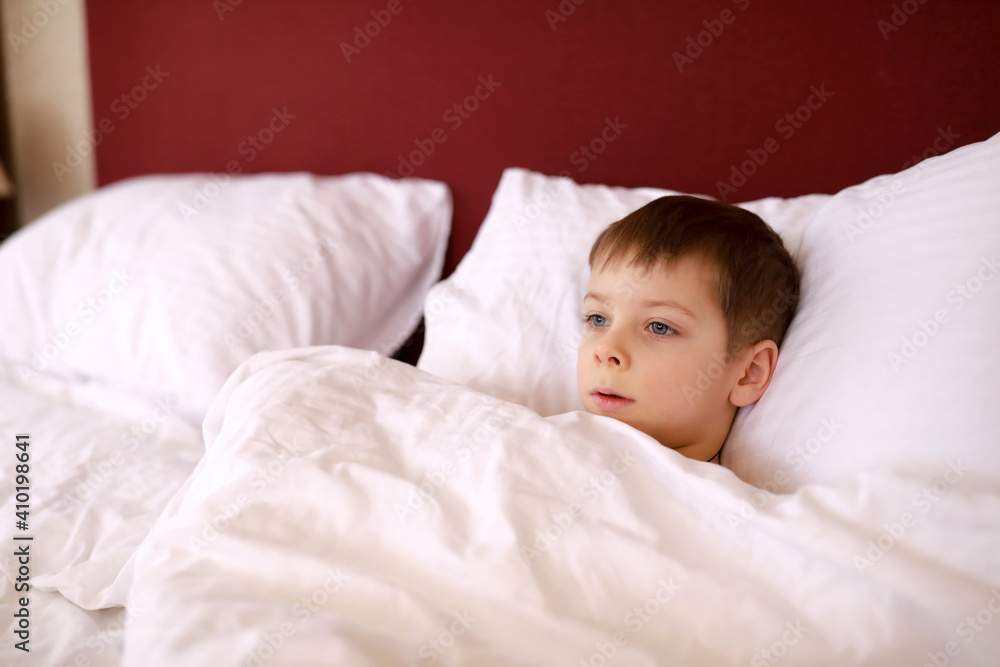 Child lying in bed