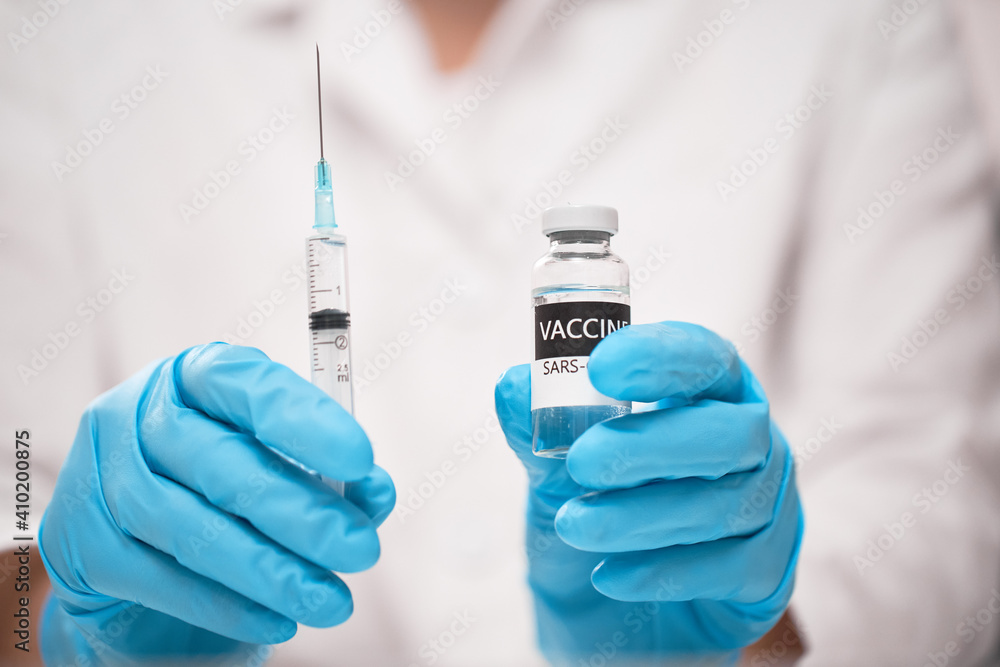 Coronavirus Vaccine concept in hand of doctor with blue gloves Coronavirus Vaccine concept in hand of doctor with blue gloves