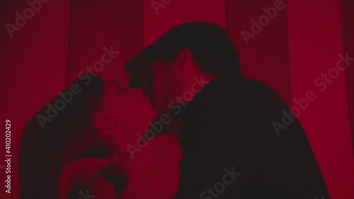 passionate kisses in a nightclub