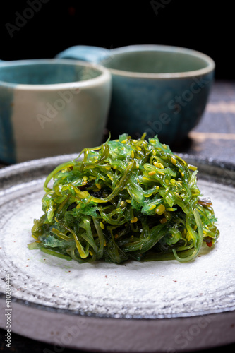 Tasty vegetarian sea food from Japan, green seaweed wakame salad