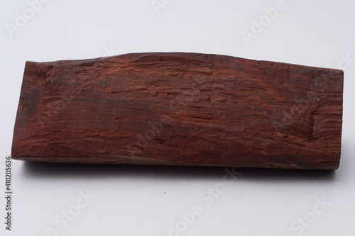 One sandalwood log on white background
