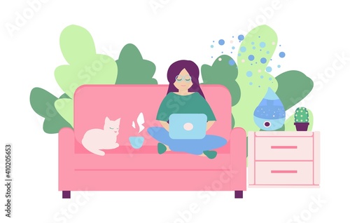 Freelancer working at home Young women seat on sofa with note book and humidifier on nightstand The cat lies next to the girl