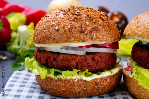 Tasty hamburger made with vegetarian plant based imitation minced meat burger and fresh vegetables