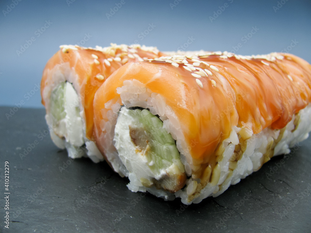 Sushi Philadelphia. Sushi with cream cheese, cucumber, eel fish, rice, salmon and sesame seeds. Sushi Philadelphia. Sushi with cream cheese, cucumber, eel fish, rice, salmon and sesame seeds.