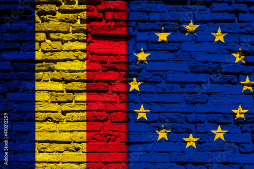 Flag of Romania and Europe on brick wall