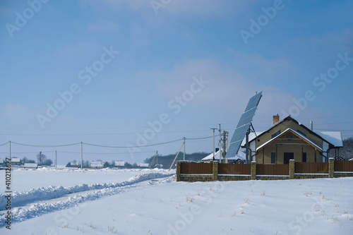 Rural winter landscape with solar panels. Copy space. 