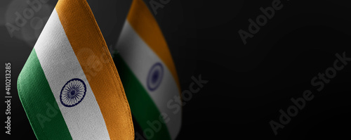 Bild auf Leinwand Small national flags of the India on a dark background