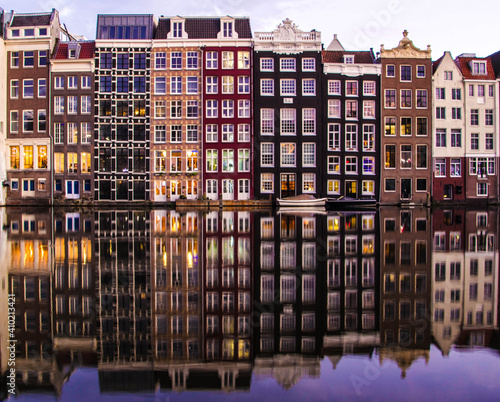amsterdam houses on a canal with reflection