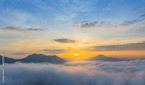 The beautiful view of the sunrise against the sea of mist at Phu Tok, Loei, Thailand. © oh_hyyo