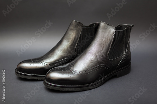 Shoes, chelsea leather boots for men. Male winter, autumn or spring fashion. Footwear on black background. Sale