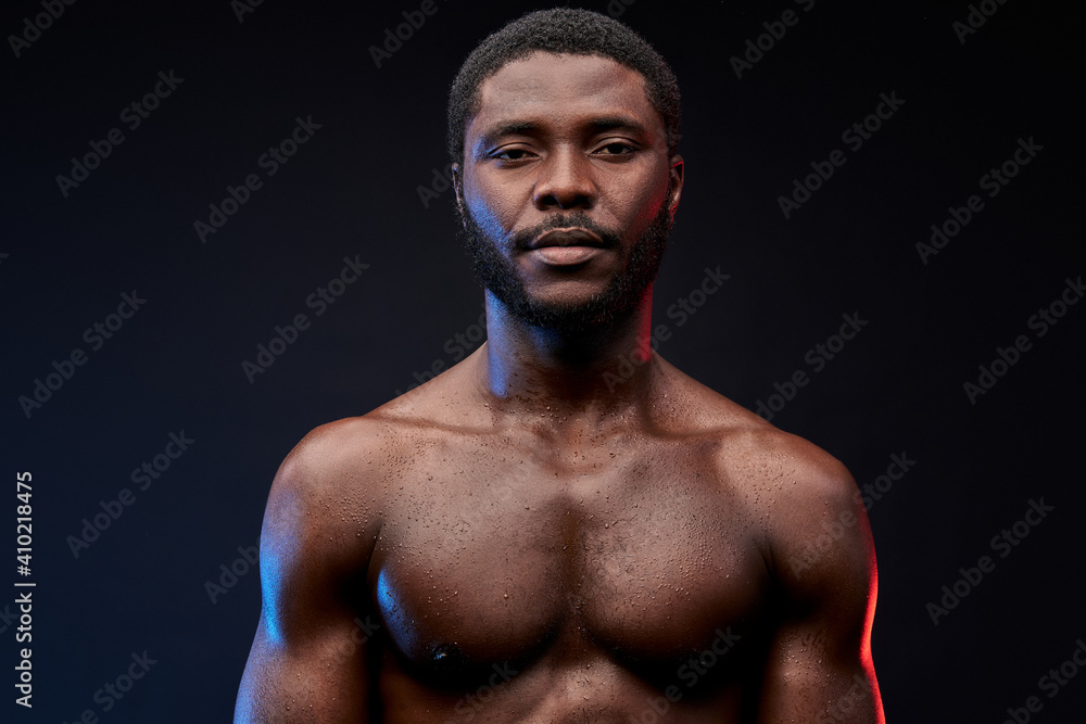 strength. muscular african american man showing naked torso while posing shirtless isolated on black, sports, workout, bodybuilding concept
