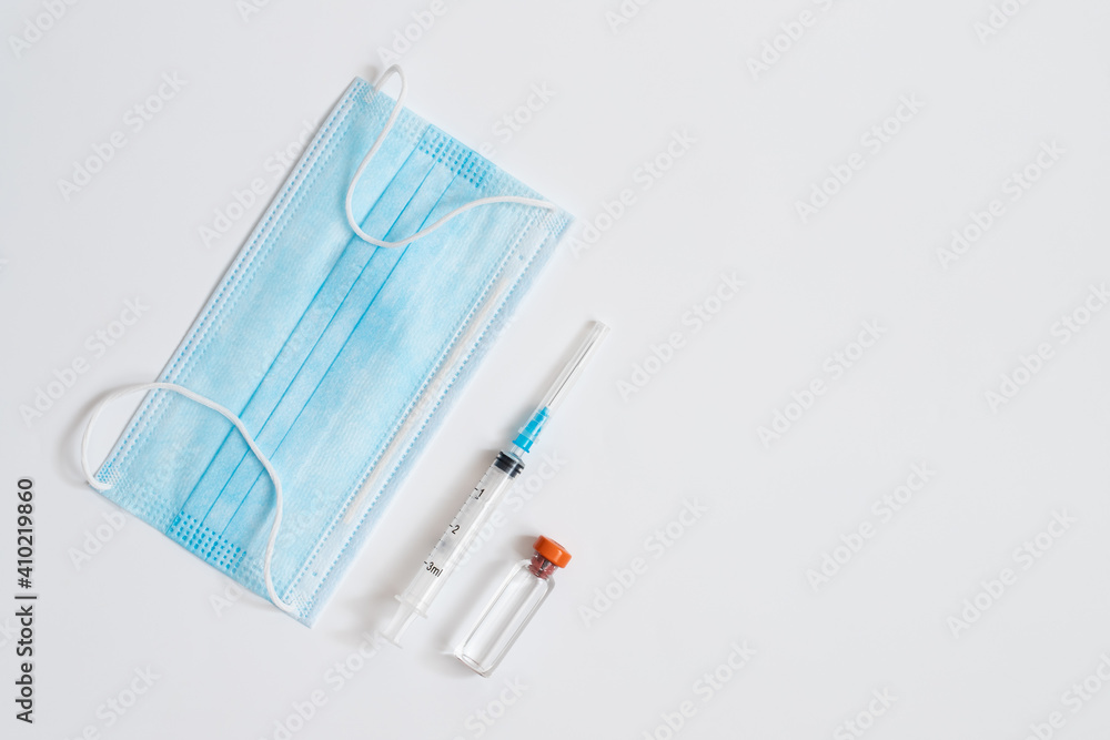 Medical Mask, Syringe And Bottle On White Background. Medical Mask, Syringe And Bottle On White Background.