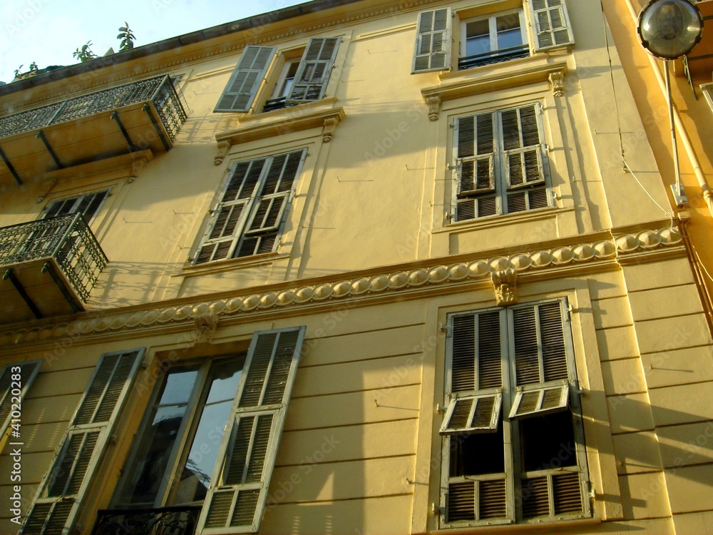 French style windows and shutters in an old house in Cannes, France.
