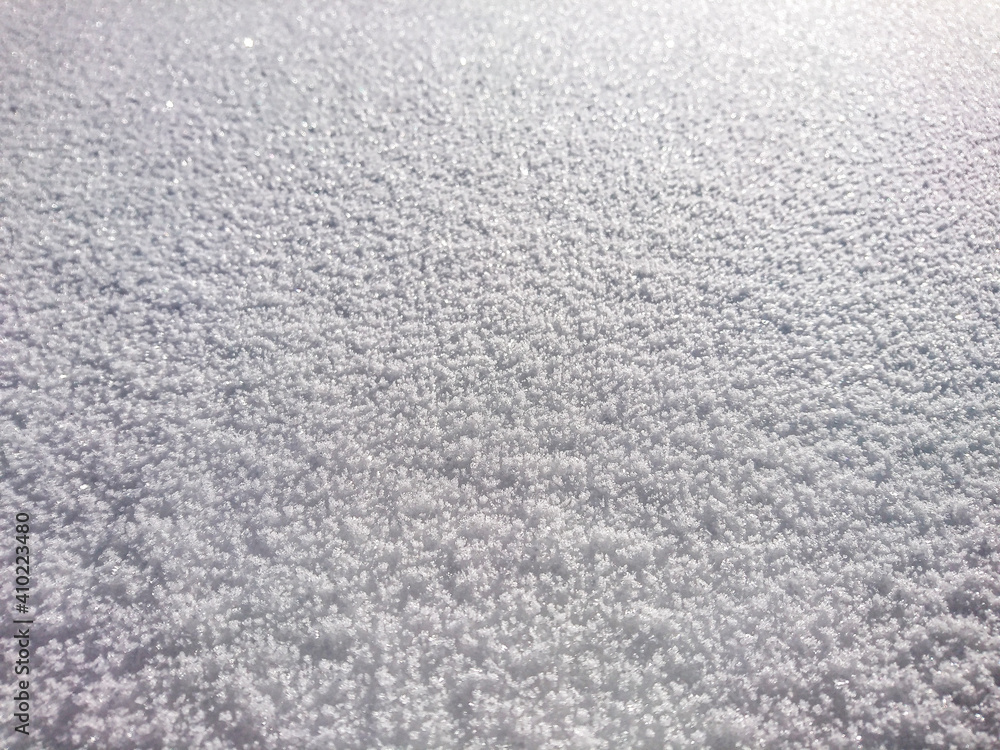 cool graphic structure of fluffy snow, snowy land, i.e. winter on a beautiful sunny and cold day. cool graphic structure of fluffy snow, snowy land, i.e. winter on a beautiful sunny and cold day.