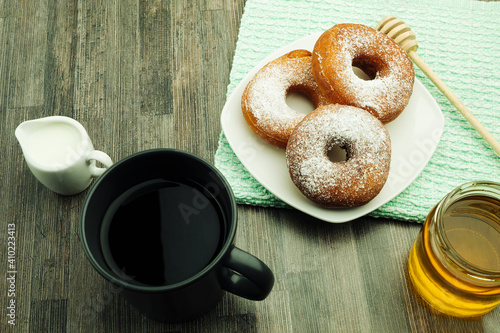 Donut and coffee with milk for breakfast