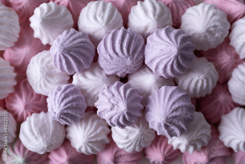 White, lilac and pink meringue cookies. Macro. Top view.