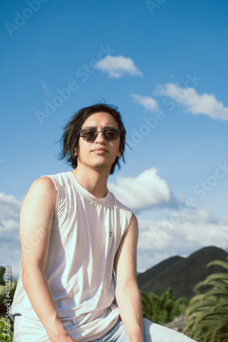 portrait of a gen z man in a sunny day